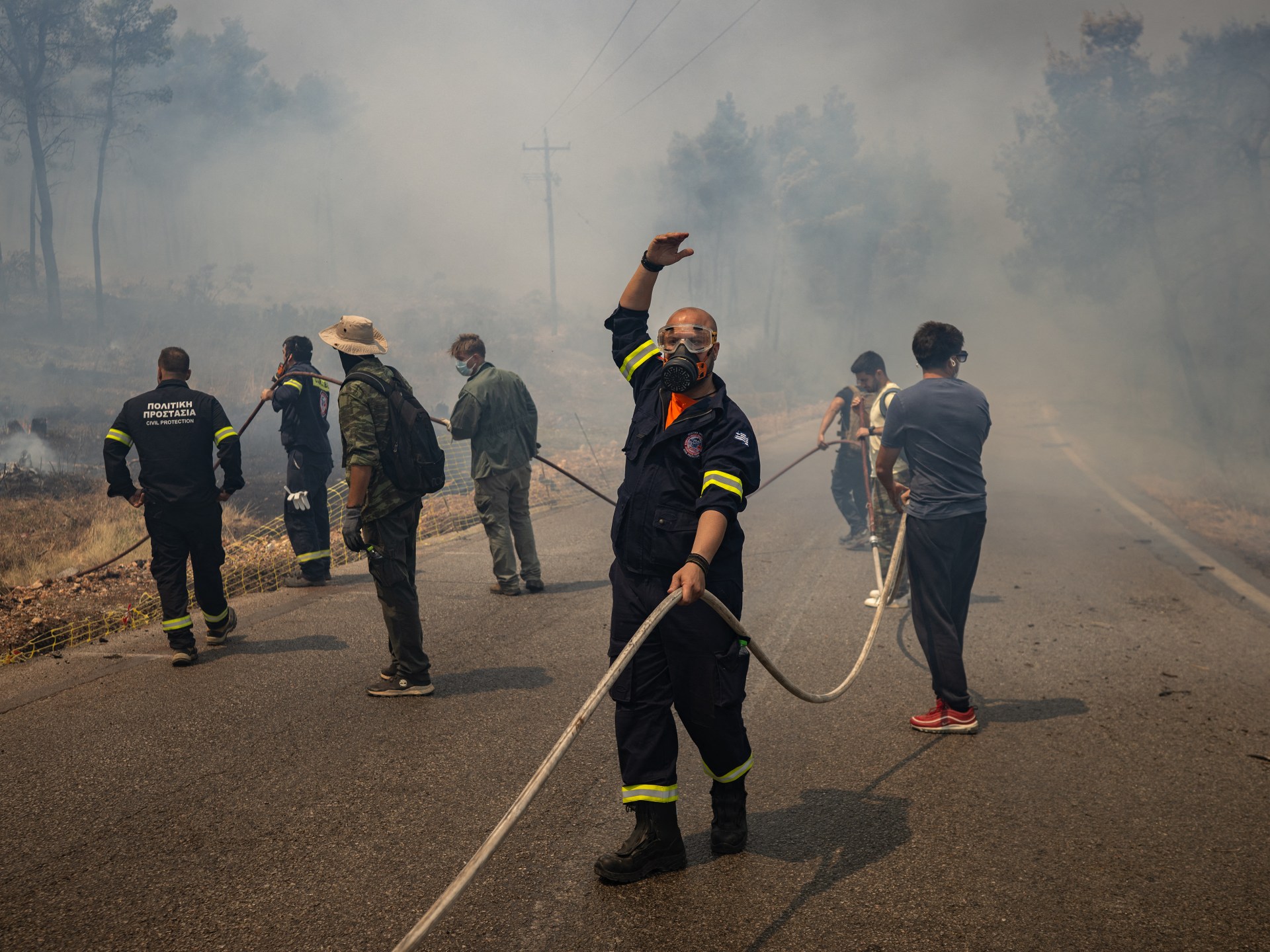 Firefighting helicopters collide, killing two, as Greece battles wildfires