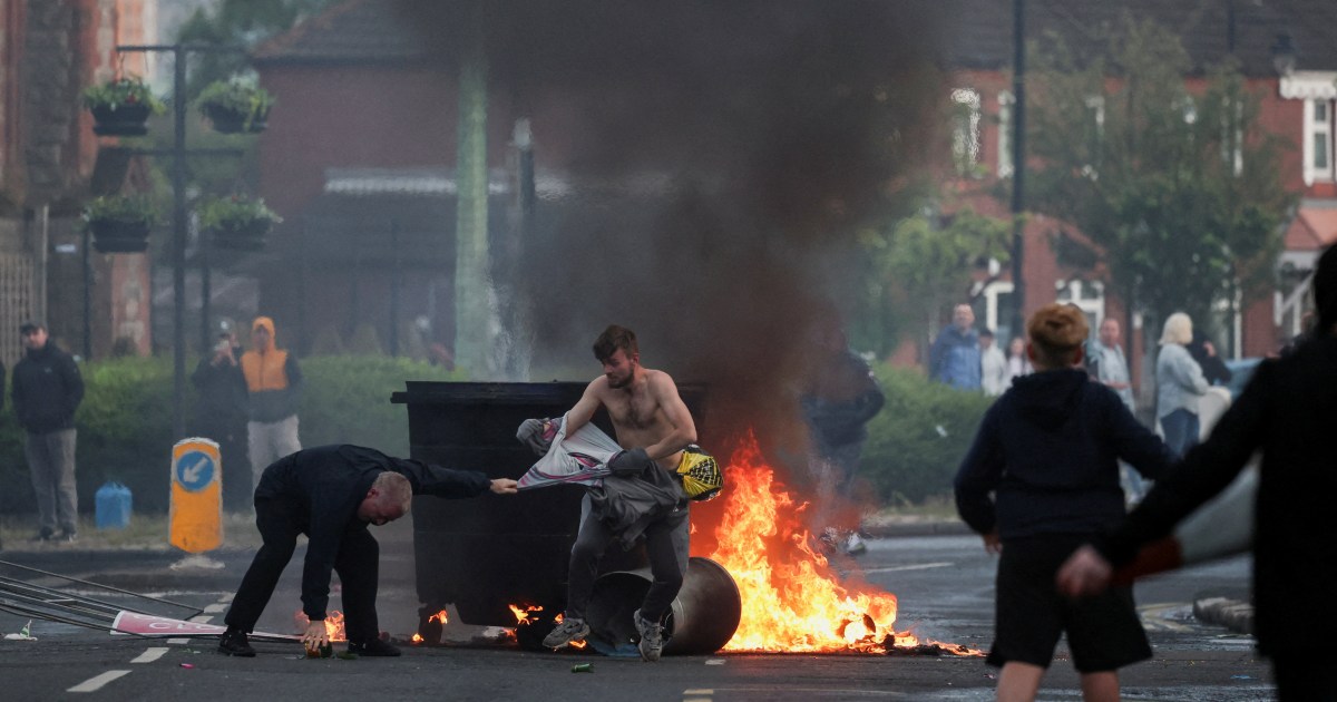 Protesters torch cars, buildings in Belfast after knife attack